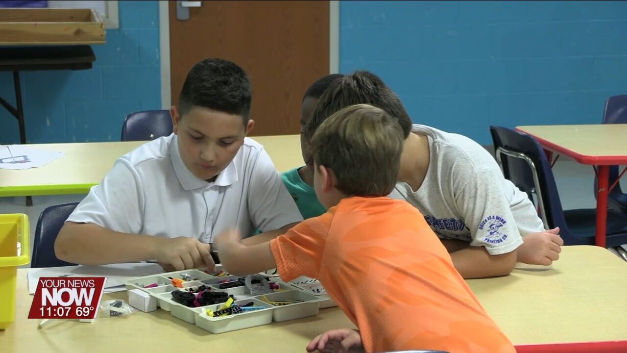 Kids work on collaborative and STEM skills with the Lego program at Lima YMCA